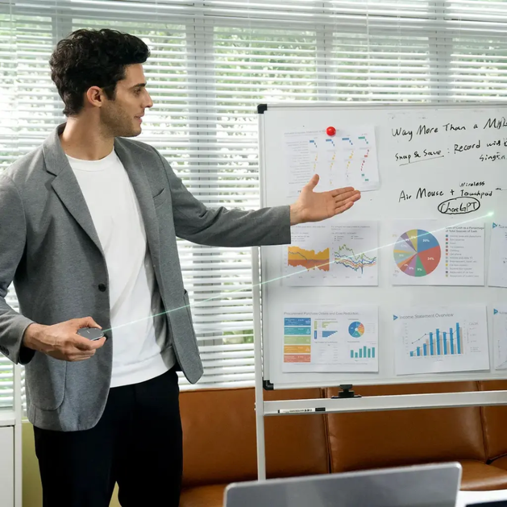 Man using Porodo air mouse laser pointer for office presentation