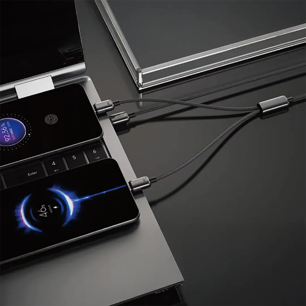 Black dual USB-C cable splitting to charge two phones and one laptop at once