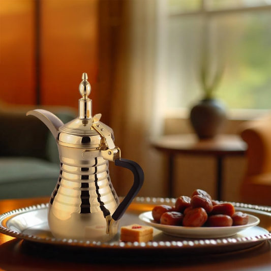 Gold LePresso electric coffee maker on tray with dates for Eid gathering