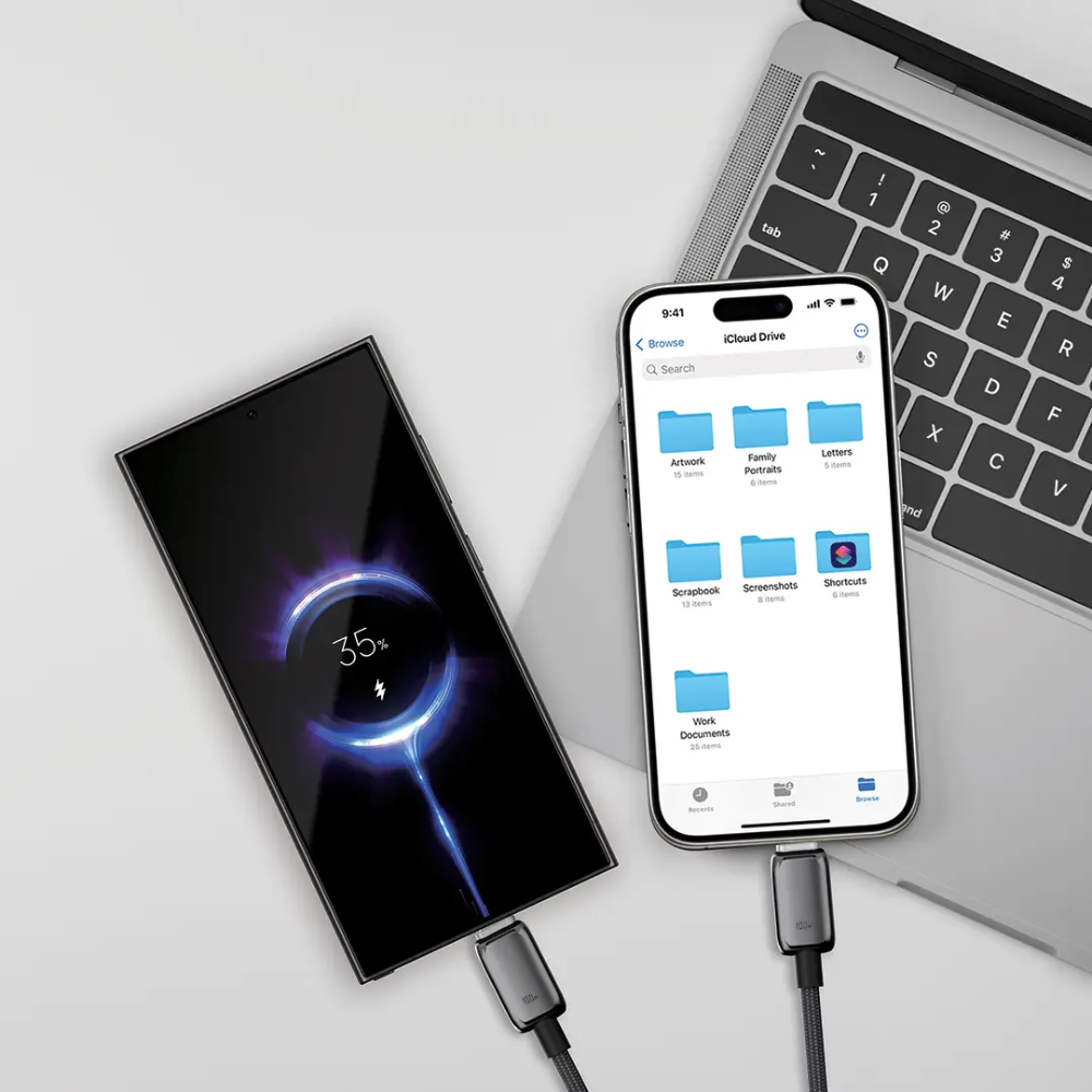 Black Powerology 100W USB-C cable charging smartphone and laptop simultaneously