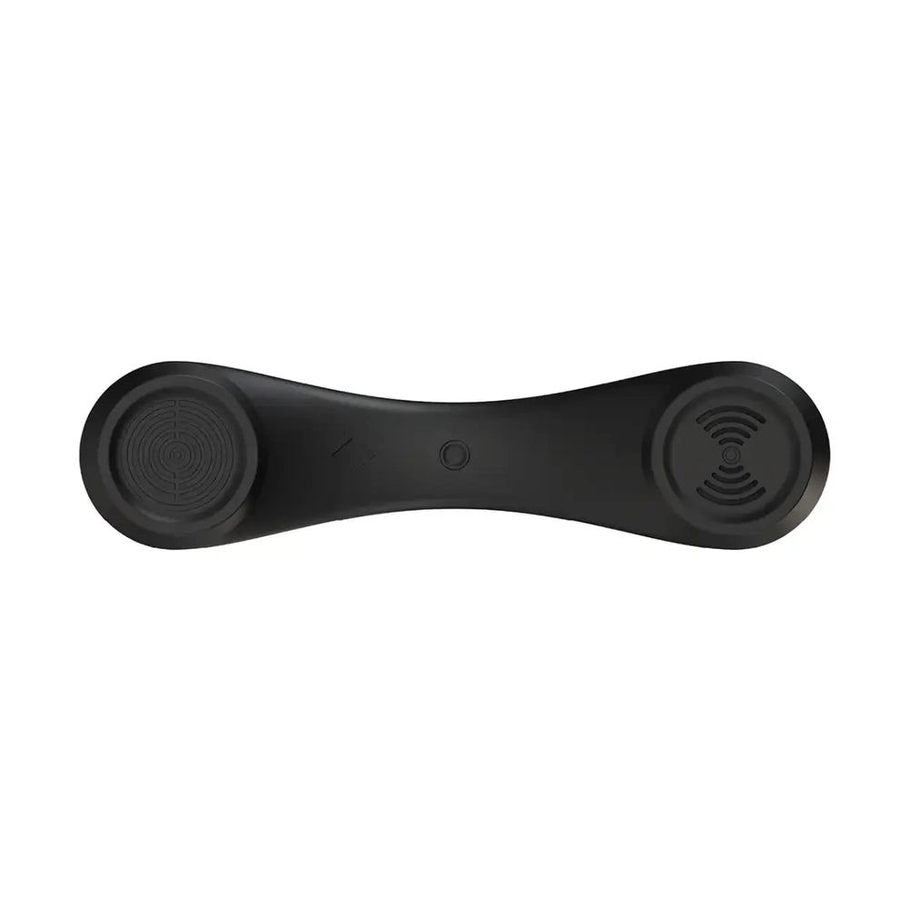 Top view of black Porodo retro phone showing symmetrical design and wave-pattern speaker