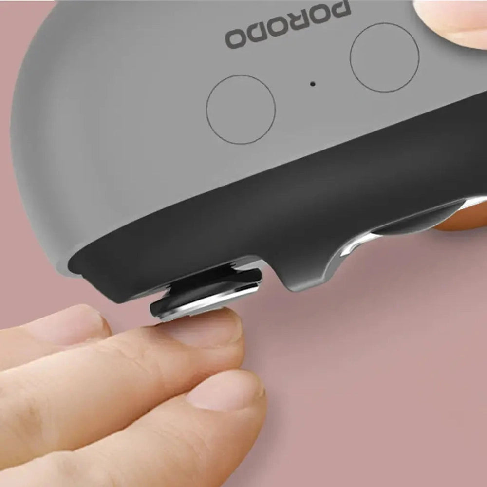 Porodo electric nail clipper close-up showing metal cutting head and gray black design