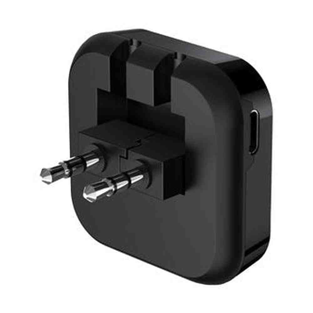 Black travel adapter on a white background