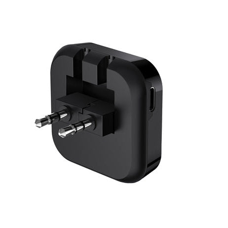 Black travel adapter on a white background