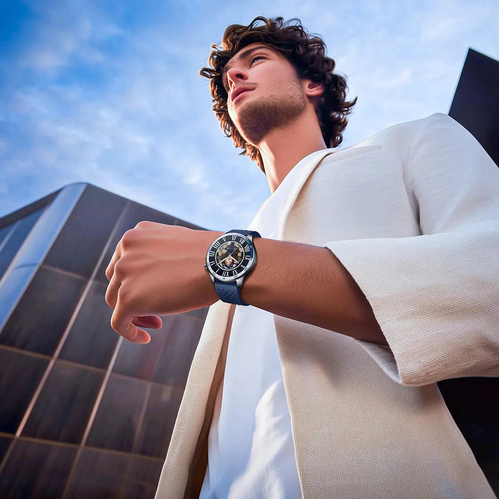 Man wearing silver Powerology smartwatch with skeletonized mechanical-style dial on wrist