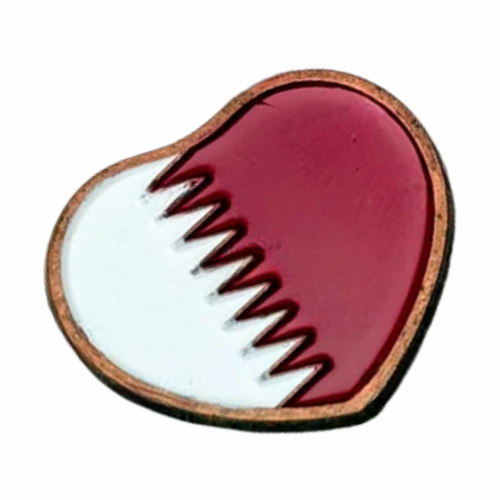 Qatar heart-shaped metal badge with red and white enamel design