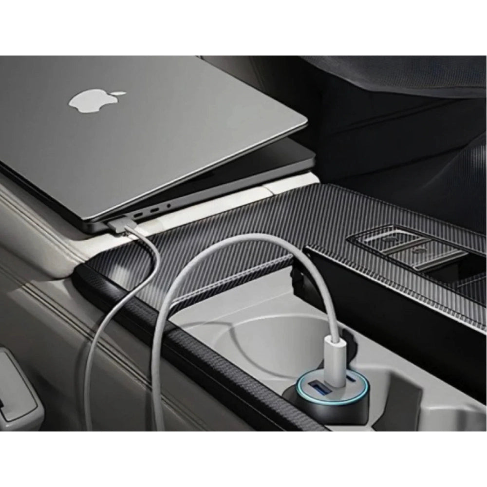Anker car charger charging laptop in cup holder with blue LED ring