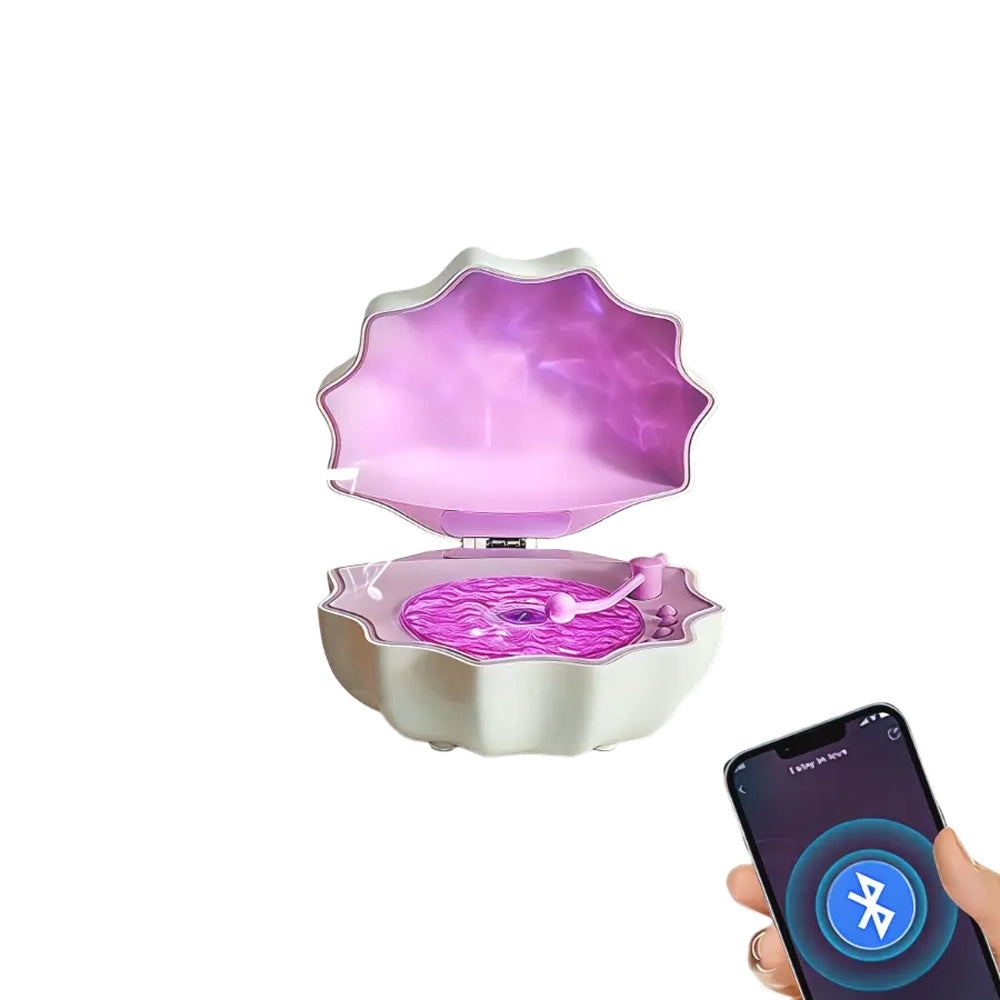 Pink shell Bluetooth speaker connecting to smartphone via wireless pairing for music playback