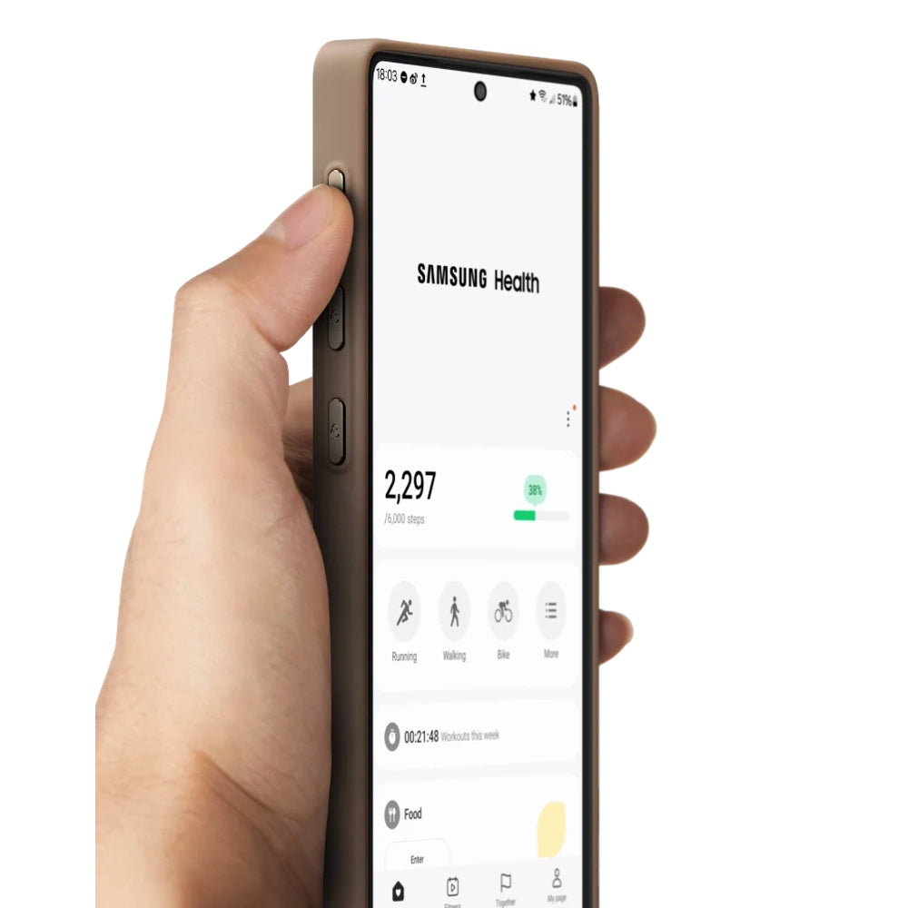 Hand holding Samsung phone in slim brown Pitaka S25 case displaying health app