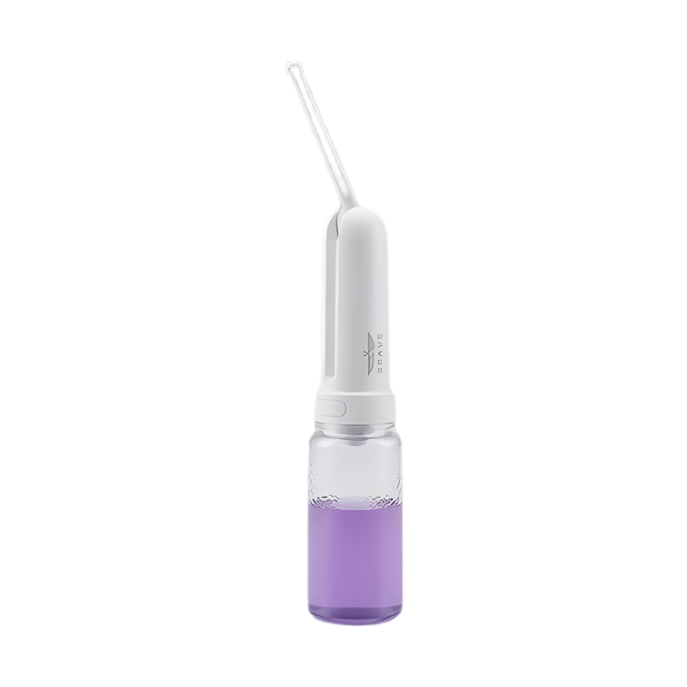 White portable bidet with purple liquid in water tank