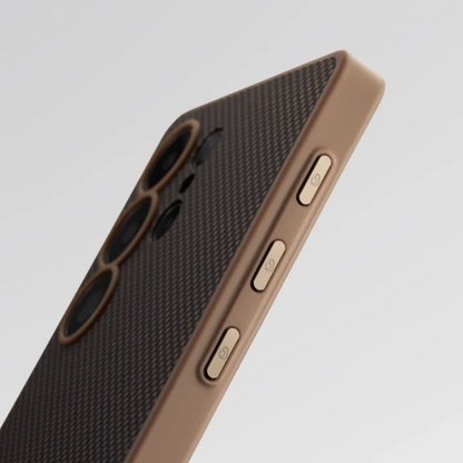 Close-up of Pitaka S25 brown case buttons and carbon fiber texture detail
