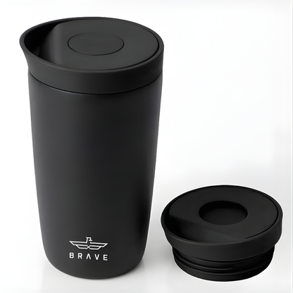 Brave matte black travel mug with winged logo and flip-top lid