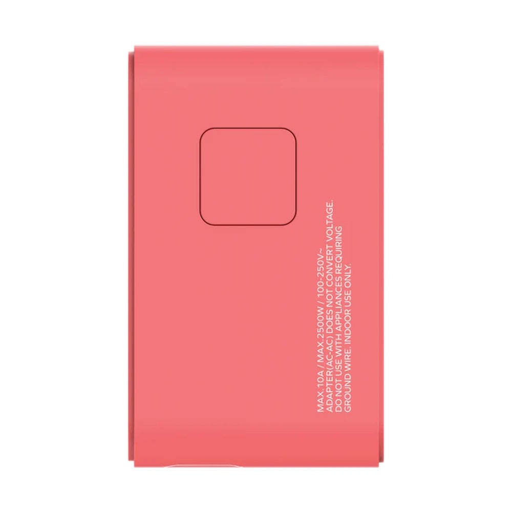 Coral pink Momax product box showing safety warnings and voltage specifications